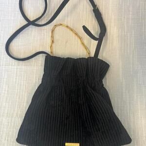 Black corduroy Charles & Keith bag with gold accents